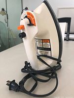 Full side view of GE Light 'n Easy iron with cord