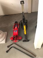 Group shot showing floor jack, scissor jack, and two tire irons