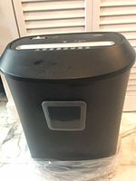 Front view of black paper shredder