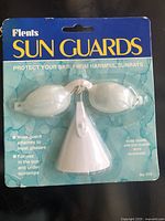 Front of sealed package showing eye goggles and nose guard