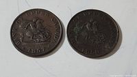 Pair of Bank of Upper Canada tokens dated 1857 and 1850 showing front side with rider and dragon design