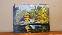Full view of David Watt oil painting entitled Fall Reflections showing autumn trees and reflections on water