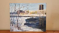 Full front view of oil painting showing Rideau River frozen in winter with Carleton University buildings in background.