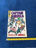 Front cover of Captain America No. 104 comic showing full cover art with characters and logo