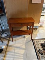 Image showing the front and side view of the wooden end table with drawer and lower shelf.