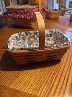 Side view of the 1993 Longaberger basket showing wooden weave and handle.