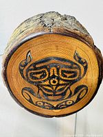 Top view showing the Haida frog carving and painting on the wooden trinket box's lid.