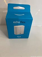 Front view of blue packaging box for Amazon Echo Flex showing product image and Alexa branding
