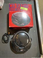 Proscan CD-Radio Boombox with original box and power cord on surface.