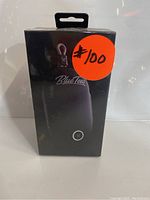 Front view of Blue Tees compact magnetic golf speaker packaging showing brand and product image.