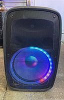 Front view of ION Total PA Glow 3 speaker showing the front metal grille and illuminated LED ring around the woofer.