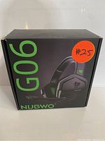Front view of the black and green Nubwo G06 wireless gaming headphones box with model number and branding