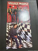 Two vinyl record covers placed side by side: Village People - Macho Man on top, and Steven Wright - I Have a Pony below.