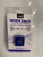 Front view of original retail packaging showing CME WIDI Jack device and branding.
