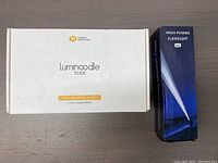 Box for Luminoodle Click stick-anywhere lighting and box for high-power LED flashlight