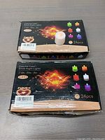 Two boxes containing 24 pieces each of Colorful Color Small Night Lights, total 48 lights.
