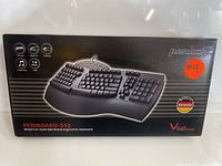Original boxed Periboard-512 ergonomic keyboard showing branding and box details