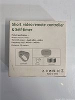 Back of the box showing product specifications, wireless version Bluetooth 5.0, transmit power -44 dBm, frequency 2.40GHz-2.48GHz, distance 10 meters, includes controller, charging box, USB Type-C cable, instructions.