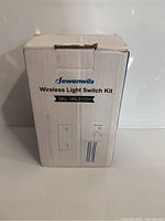Front view of the Dewenwils Wireless Light Switch Kit box showing brand and product name.
