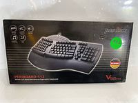 Front of the box showing image of Perixx Periboard-512 keyboard, branding, and key product features.
