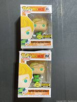 Photo of two boxed Funko Pop! vinyl figures of Super Saiyan Gohan with glow-in-the-dark and Entertainment Earth exclusive labels.