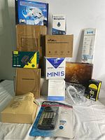 Full lot image showing all item boxes and packaging on table.