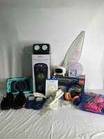 Full view of all items including projector, footwear, wings, costume, timer, speakers, charger, and headphones