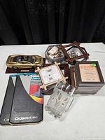 Group view showing Jaguar model, pitcher, stitchery frames, mud flaps, keychain