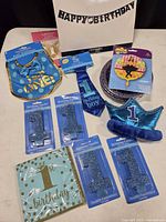 Overall view of first birthday party supply lot