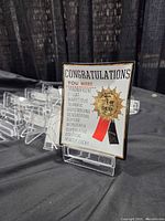 Acrylic stands stacked behind novelty glass plate