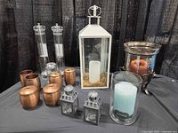 All items grouped: lanterns, candles, copper accessories, grinders