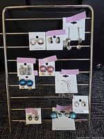 All ten earring pairs displayed on rack