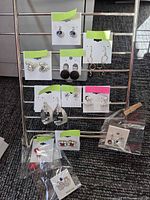 Rack showing 9 pairs on cards and 3 pairs in bags