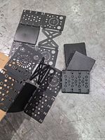 multiple folded boards with perforations spread on floor