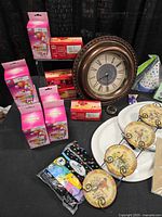 Overview of candles, clock, plates, balloons, hats, mini plates in rack