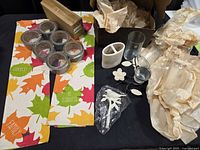 Entire lot with LED lights packaging, eight tape rolls, toothbrush holder, candle holder components, bird hook in bag