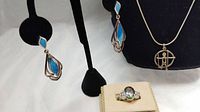 Photo showing the set with turquoise inlay large drop dangle earrings and sterling silver necklace with swinging child pendant, along with the mystic topaz and crystal stone ring