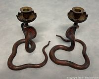 Front view showing both cobra candle holders side by side