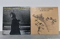 Front covers of Neil Young and Bob Dylan vinyl records shown side by side