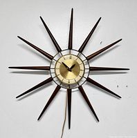 Front view of clock showing starburst pattern