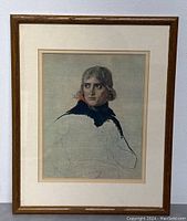 Frontal photo of framed unfinished portrait print showing wood frame and mounted mat around the portrait.