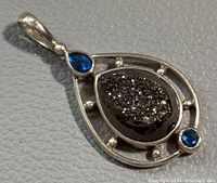 Front view showing druzy centerpiece and blue stones