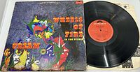 Front cover of the Cream Wheels Of Fire LP record showing the colorful psychedelic artwork.