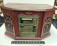 Full view of the retro style Memorex cabinet with speaker grills on the sides and the central control panel.