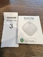 Photo of the product packaging showing the Smart Tag GPS tracker and Apple Find My compatibility.