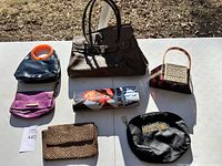 Overview of all seven bags on white table surface