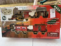 Boxed Jumbo Santa's Express train set showing locomotive, tender, and caboose on display in original packaging.