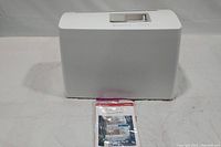 Closed carrying case and user’s guide in plastic bag