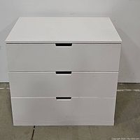 Front view of white 3-drawer IKEA Nordli dresser showing clean lines and cut-out handles.