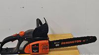 Side view of Remington Versa Saw RM1645 electric chainsaw showing the full blade and handle.